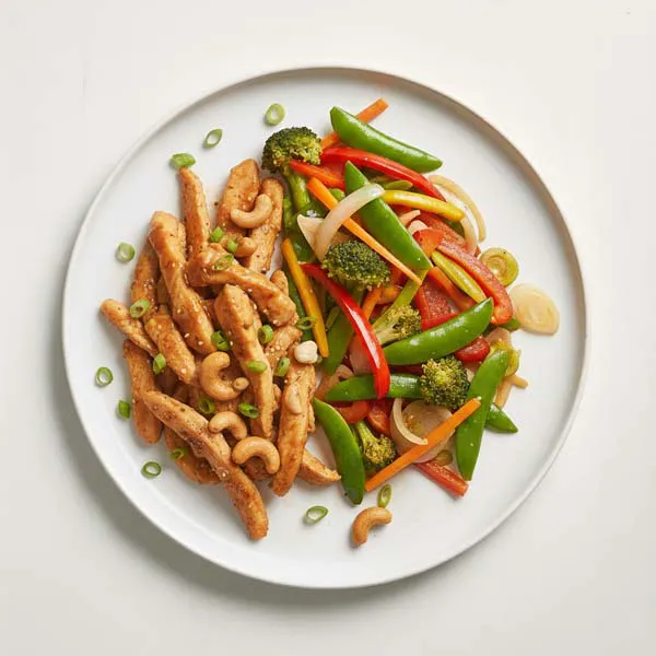 Sweet and tangy cashew nut chicken with stir-fried vegetables